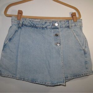 Zara women denim skort featuring a light blue wash and wrap style front